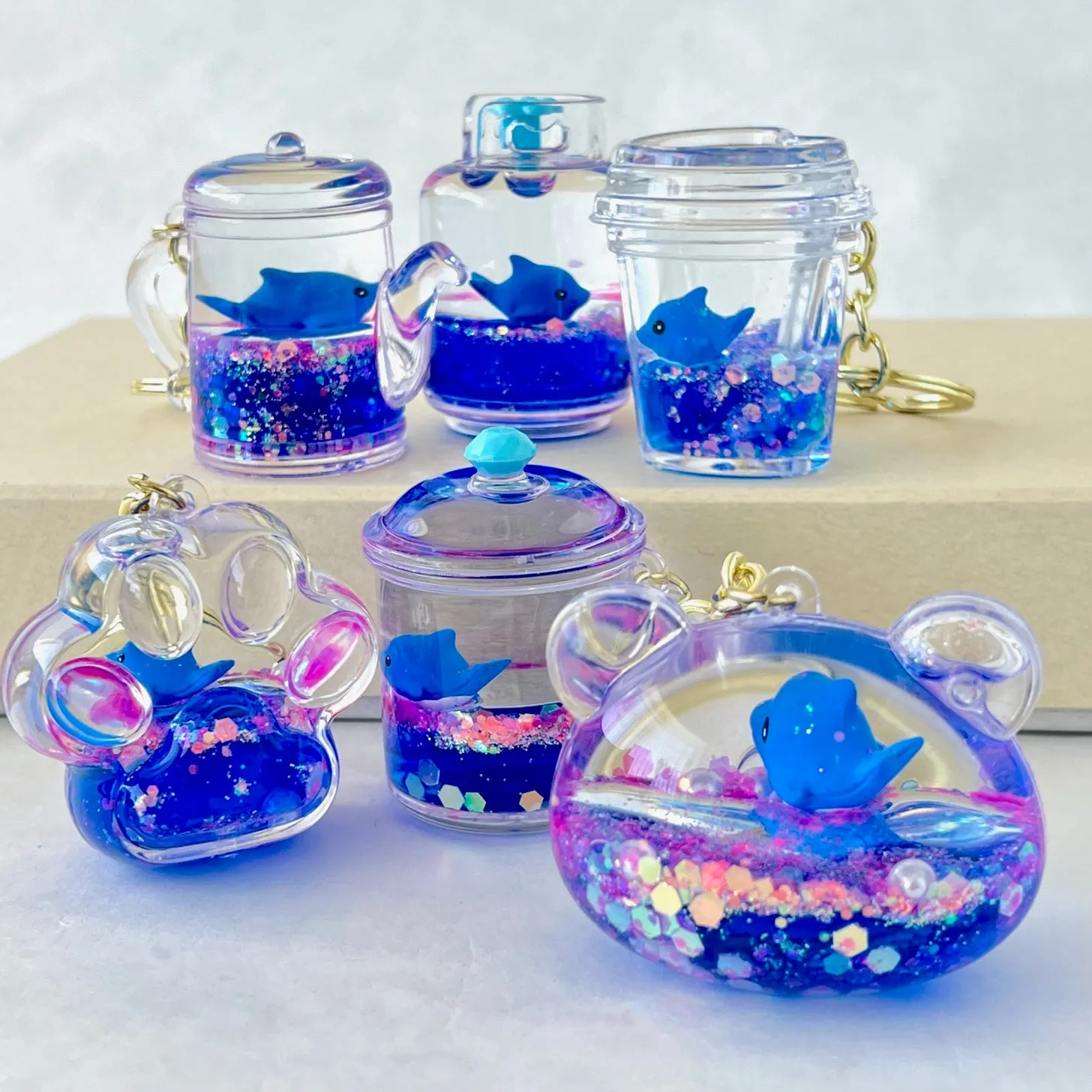 12129 BLUE DOLPHIN COMBO FLOATY KEY CHARM-12